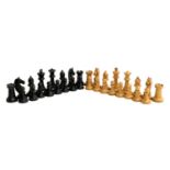 A wooden chess set, the King approx. 8cm high