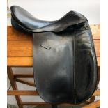 A Martin Kinlet dressage saddle, 16", with cover; and a 17" saddle (af) (2)