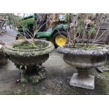 A pair of composite stone garden urns on stands, 50cmD