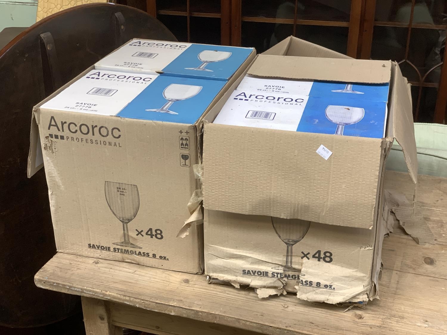 A quantity of boxed Arcoroc wine glasses (100+); together with boxed tumblers and champagne flutes