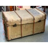 A very large canvas and wood banded travel trunk, in as found condition, 101cm wide