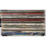 A mixed lot of approx. 40 pop and rock vinyl LPs to include David Bowie, Bob Dylan, Skinhead, Cat