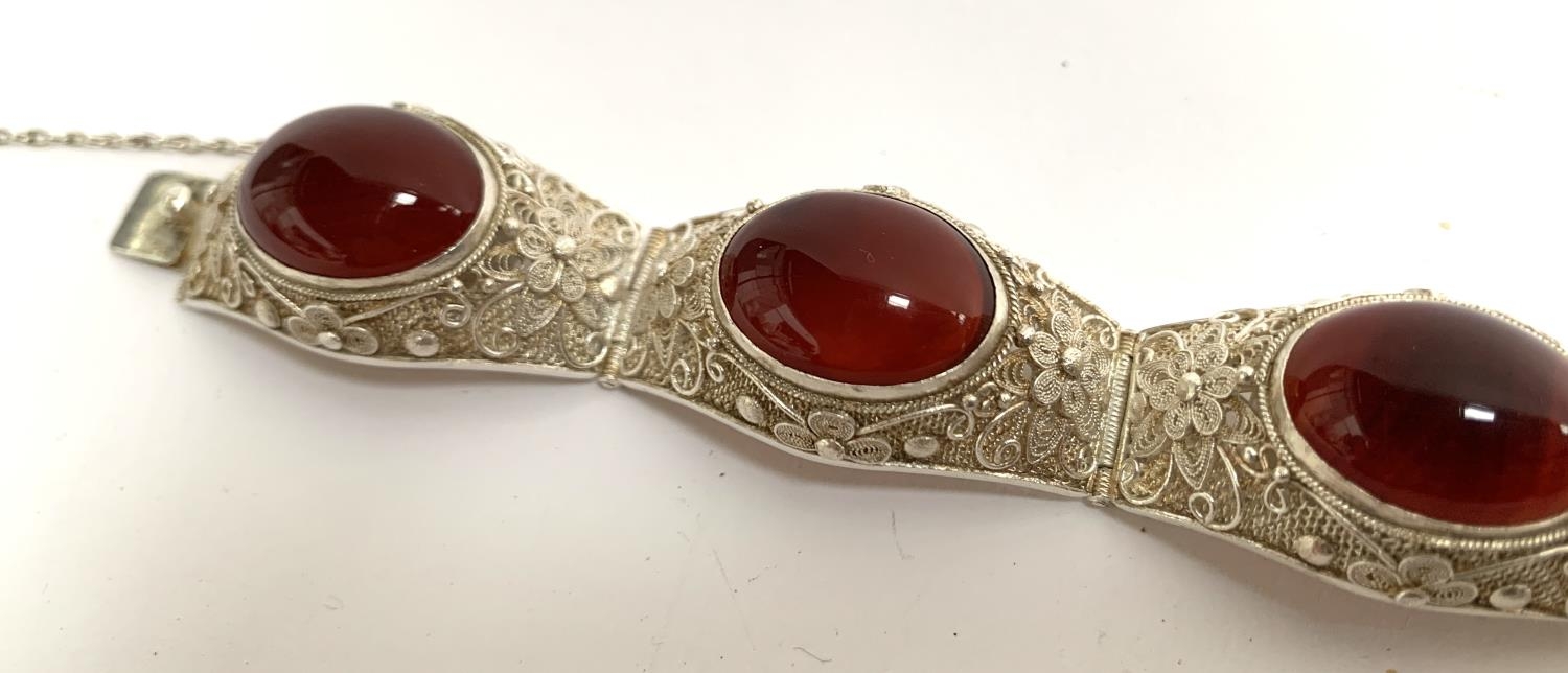 An early 20th century Chinese export silver filigree bracelet set with carnelian cabochons, with - Image 3 of 4
