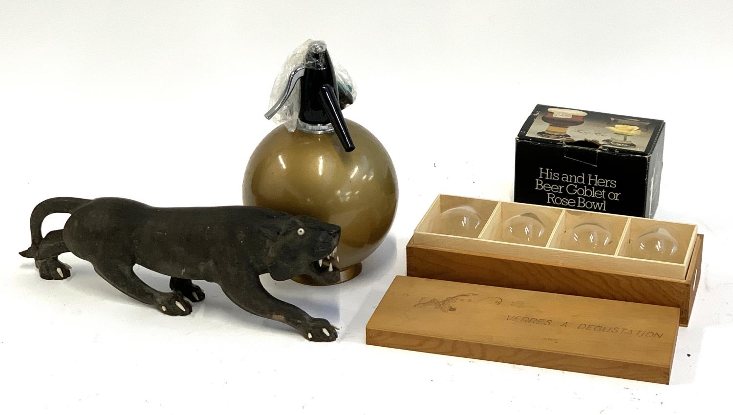 A carved hardwood figure of a panther; a soda siphon; Jim Beam tumblers; Dartington glass his and