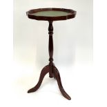 A 20th century wine table, 60cmH
