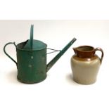 A large stoneware jug, 26cmH, and a watering can