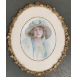 An early 20th century watercolour portrait of a women in a white hat, signed R. Ponnet lower