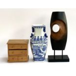 An abstract sculpture, a blue and white Taiwanese vase; and a small set of jewellery drawers
