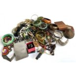 A mixed lot of costume jewellery to include necklaces; bangles; costume rings; cigarette case;