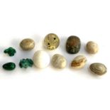 A quantity of mineral eggs and carved animals to include malachite bird