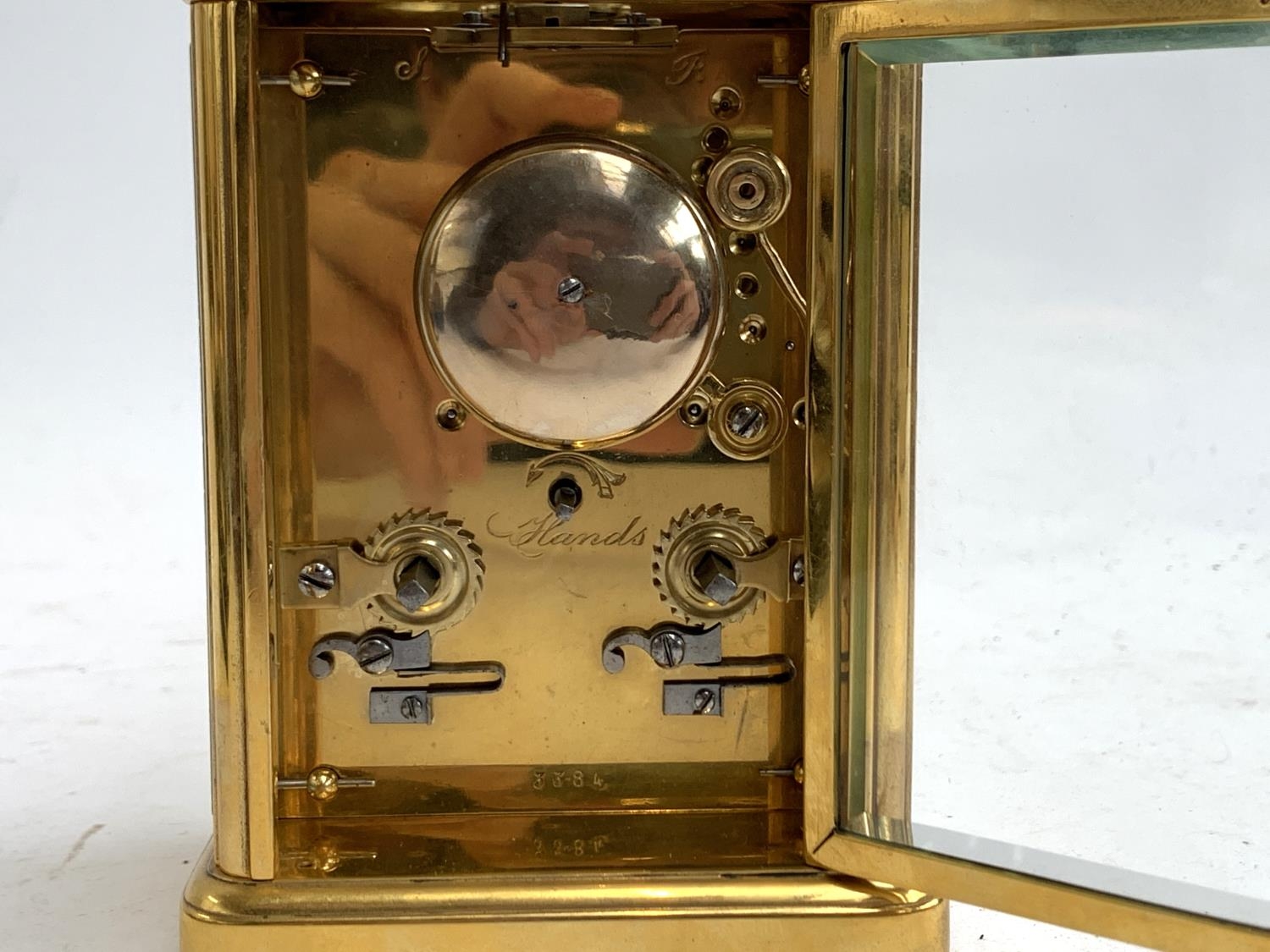 A heavy gilt metal carriage clock, bevelled glass panels, enamel dial with Roman numerals, - Image 3 of 3