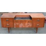 A mid century teak sideboard/dressing table, dropped formica topped central section, 151x46x66cmH