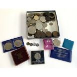 A quantity of British and world coins to include pre 1947 silver, 1879 penny, commemorative coins,