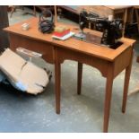 A Singer sewing machine, no. EJ294817, in table, the table 55x45x75cmH