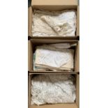 Three boxes of table and other linen
