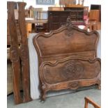 A carved French double bed with Rococo cresting, 4ft 6"