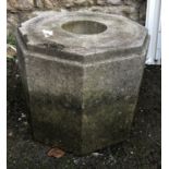 An octagonal composite stone plinth, 49cmW x 39cmH