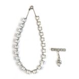 An Art Deco white metal and square paste riviere necklace, mounted in white metal, fastening with