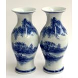 A pair of decorative blue and white baluster vases, 32cmH