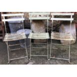Three metal folding garden chairs
