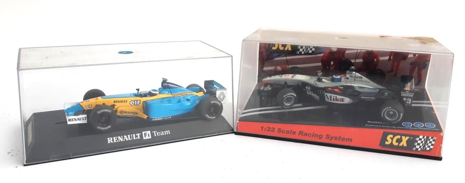 An SCX McLaren F1 car, boxed, together with a Scalextric Renault F1 car, boxed