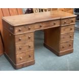 A 19th century mahogany pedestal desk, moulded invert breakfront top over traditional arrangement of