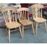 A pair of beach kitchen chairs and one other