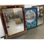 Three mirrors: one rectangular with bevelled glass and parcel gilt decoration; a circular mirror