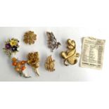 A small quantity of costume jewellery to include a large gold tone Oak leaf brooch by Monet;