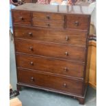 An early 20th century Heal's mahogany chest of drawers, with two small central drawers flanked by