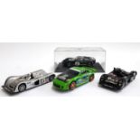 A Scalextric Ford GT Mk II, boxed, together with 2 2000 Cadillac LMP, both unboxed, and a Nissan
