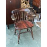 A 20th century captain's or smokers bow stick back armchair
