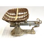 A set of vintage Harrods baby weighing scales with wicker basket