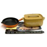 A Le Creuset frying pan 25cm diameter, an enamelled casserole, cast iron griddle / hot plate 48cm