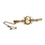 A 9ct gold bar brooch set with a carved shell high relief cameo, gross weight 3.2g, 5.3cm long