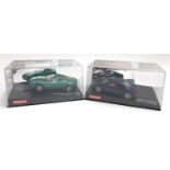 A Carrera Revolution Audi R8, boxed, together with an Aston Martin V12 Vanquish, boxed