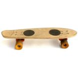 A 1970s skateboard with alibu wheels