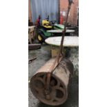 A large cast iron garden roller, the drum 50cmD