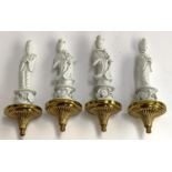 A set of four blanc de chine figural wall sconces of Boddhisatvas mounted on gilt metal plinths, one