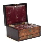 A 19th century rosewood and brass inlaid vanity set with burgundy leather interior, the case