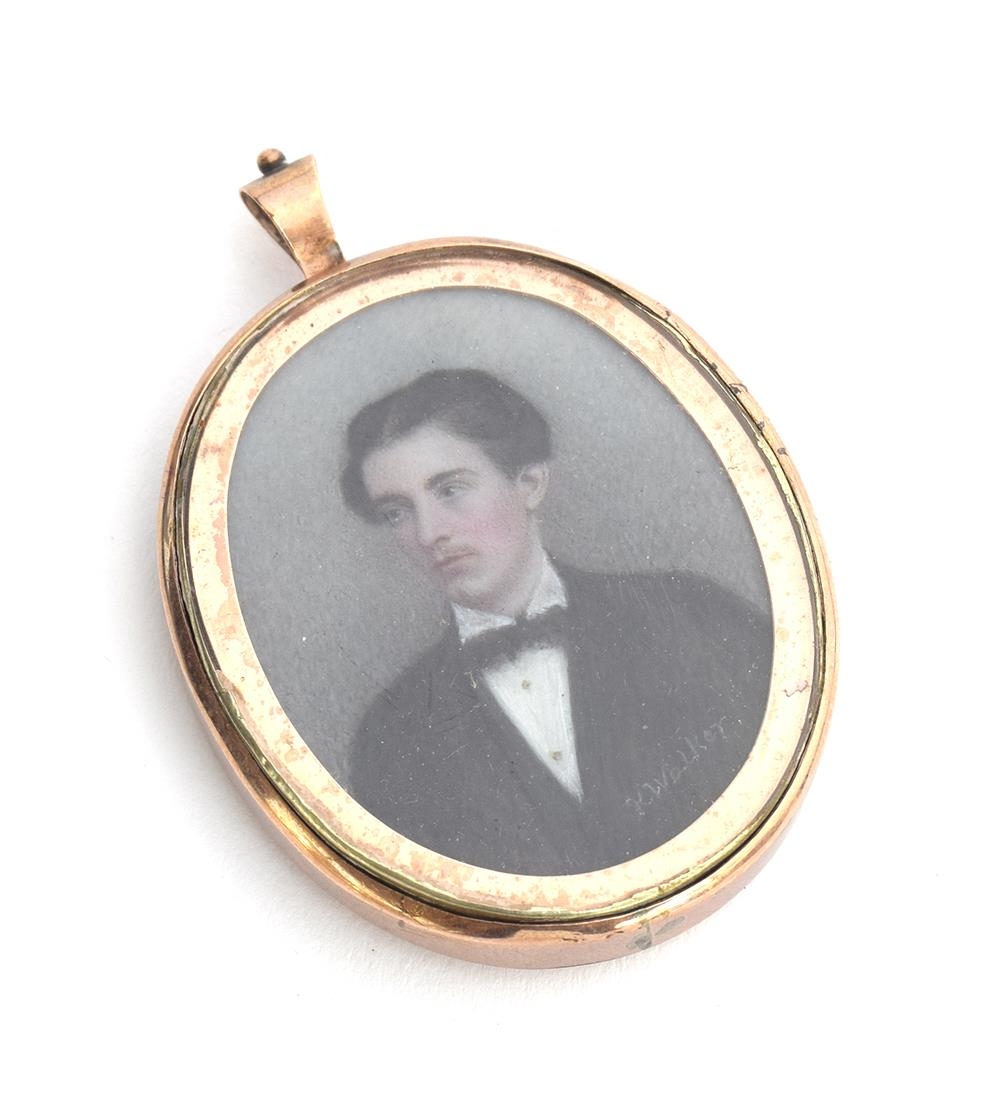 A 19th century gold locket containing a portrait miniature on ivory of a young man, signed 'K.