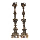 A pair of Italian 18th/19th century carved altar sticks, each approx. 92cm high, significant worm