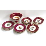 A hand painted floral part dinner service, 21 pieces comprising footed fruit bowl, serving dishes