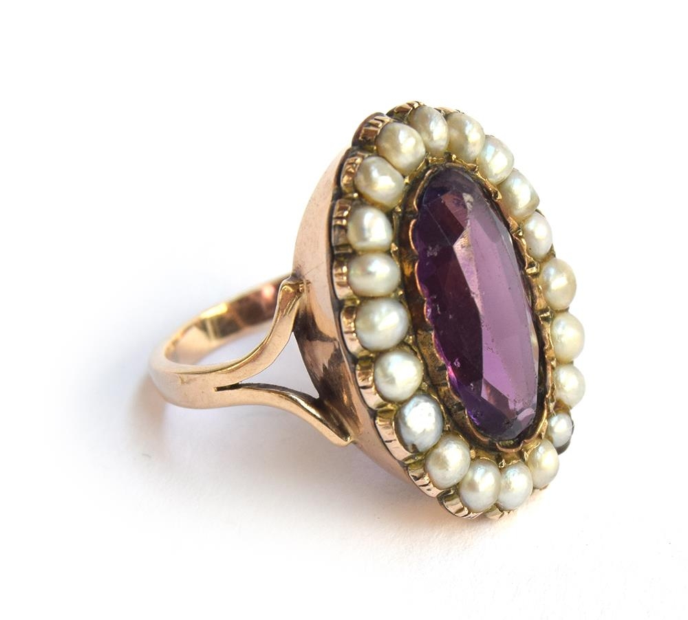 A Georgian amethyst paste and pearl ring, mounted in gold, size N, approx. 7.8g