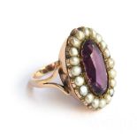 A Georgian amethyst paste and pearl ring, mounted in gold, size N, approx. 7.8g