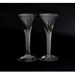 A pair of Georgian air twist wine glasses, c.1760, multi-spiral stems with folded foot, 17cm high