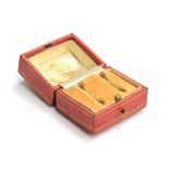 An early 20th century Cartier double ring box, red leather and gilt tooled exterior, with peach