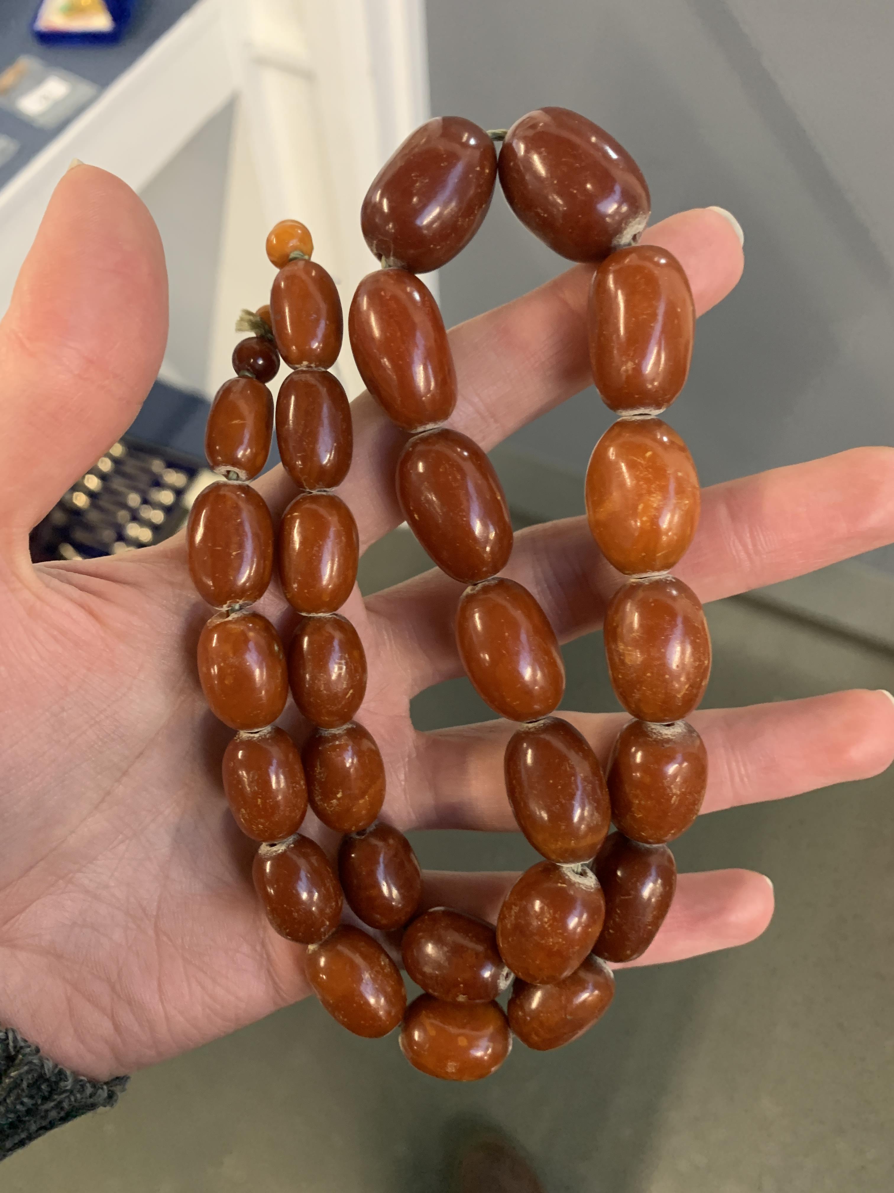 A graduated cognac amber bead necklace, approx. 59g, 57cm long - Image 2 of 4