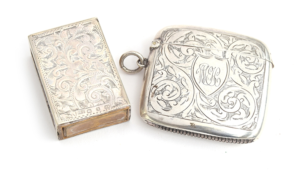 A George V silver vesta, Birmingham 1910, monogrammed and engraved with scolls; together with a