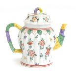 A 20th century Dresden porcelain teapot, in a Chinese style reeded bamboo baluster form, painted